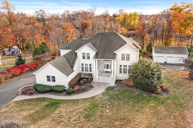 front facade with a front yard and a porch