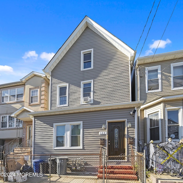 view of front of home featuring cooling unit