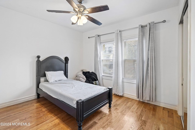 bedroom featuring ceiling fan and light wood-type flooring