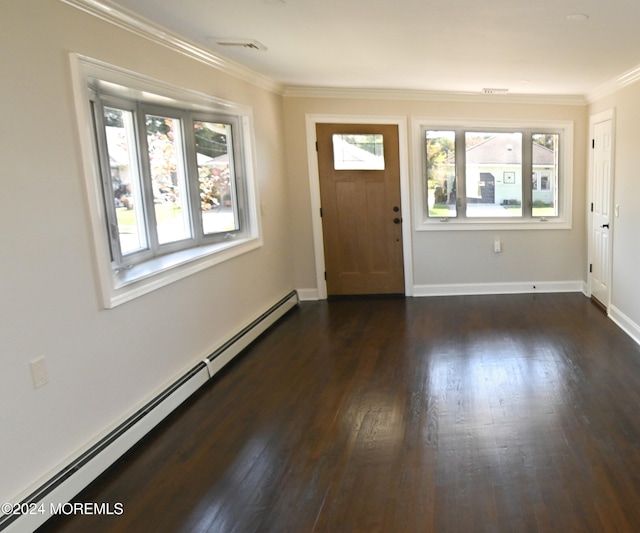 foyer entrance with plenty of natural light, crown molding, baseboard heating, and dark hardwood / wood-style floors