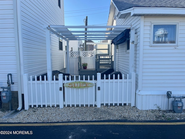 view of side of property with a pergola