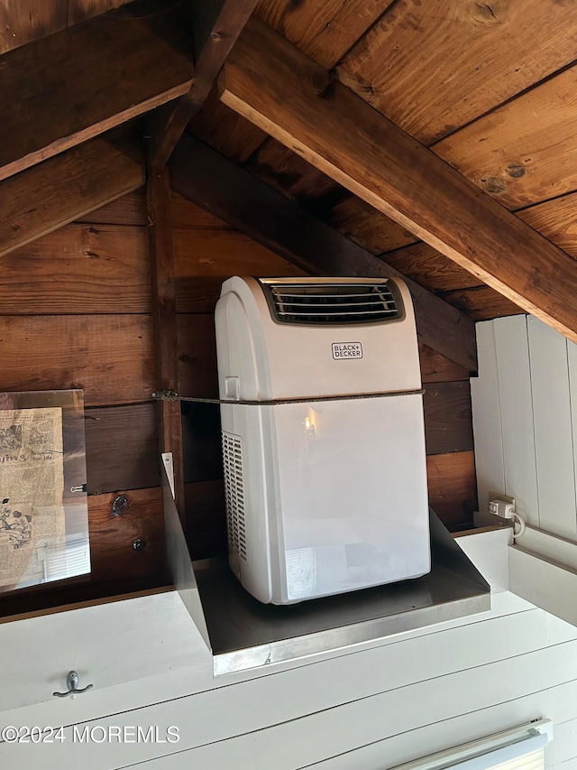 interior details featuring wooden walls and heating unit