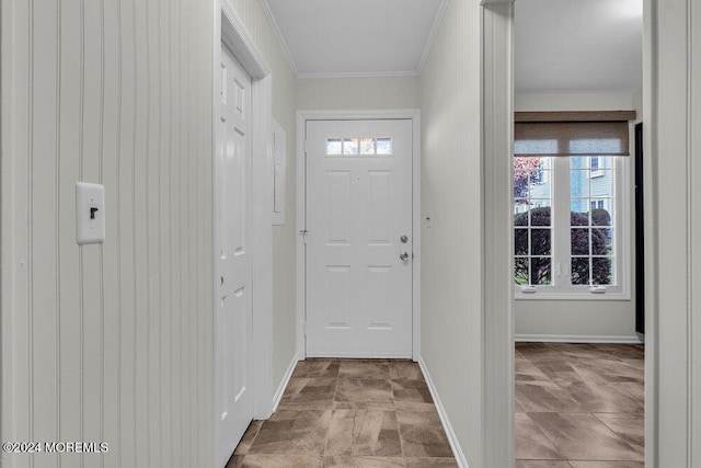 doorway to outside featuring crown molding