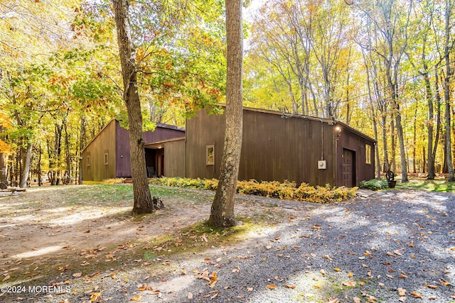 view of side of home featuring a garage