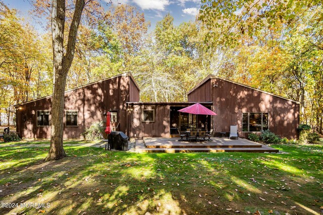 2 Filmore Dr, Millstone, NJ 08510 - back of house featuring a lawn, a deck, and outdoor dining space