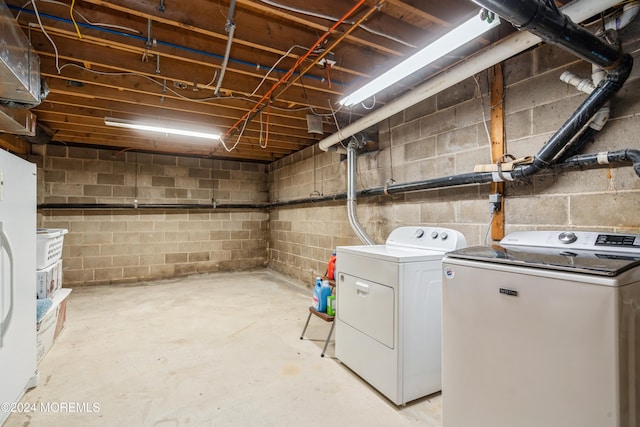 clothes washing area featuring independent washer and dryer