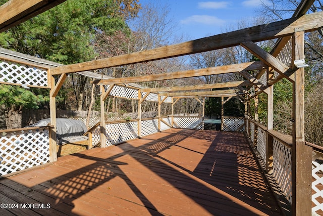 wooden terrace with a pergola