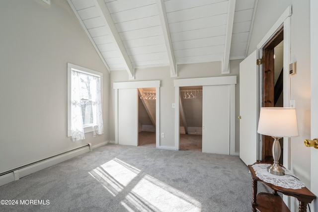 unfurnished bedroom with carpet, vaulted ceiling with beams, and a baseboard radiator