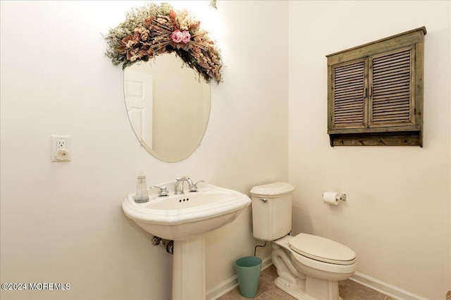 bathroom featuring toilet and tile patterned floors