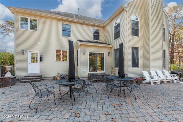 back of property with a patio area