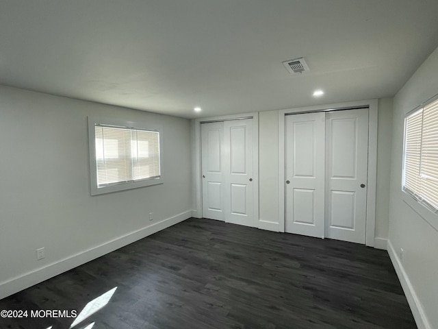 19 Nicholas Blvd, Jackson, NJ 08527 - unfurnished bedroom with visible vents, multiple closets, baseboards, and dark wood finished floors