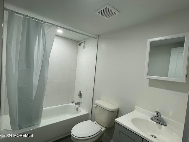 full bathroom with vanity, toilet, and shower / bath combo with shower curtain