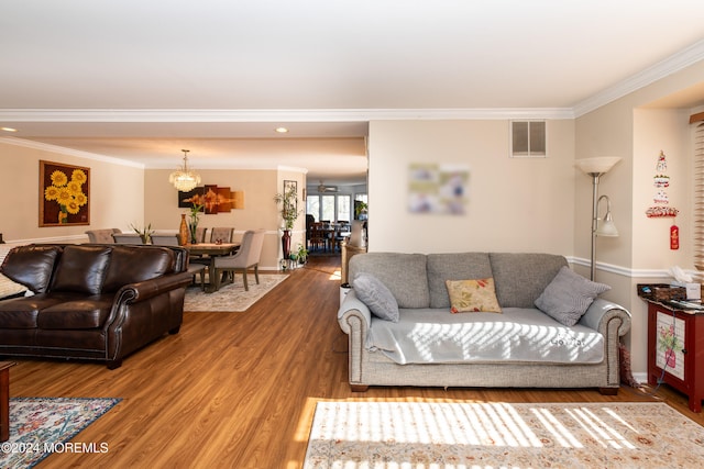 living room featuring ornamental molding and hardwood / wood-style flooring