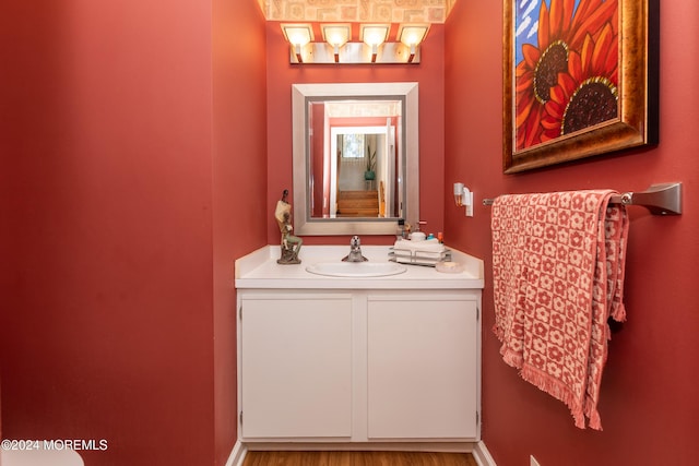 bathroom featuring vanity and hardwood / wood-style flooring