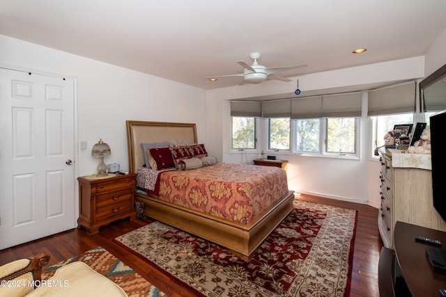 bedroom featuring dark hardwood / wood-style floors and ceiling fan