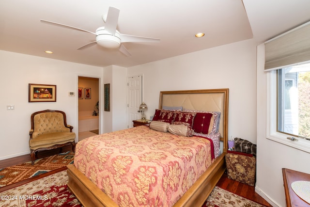 bedroom featuring dark hardwood / wood-style floors and ceiling fan