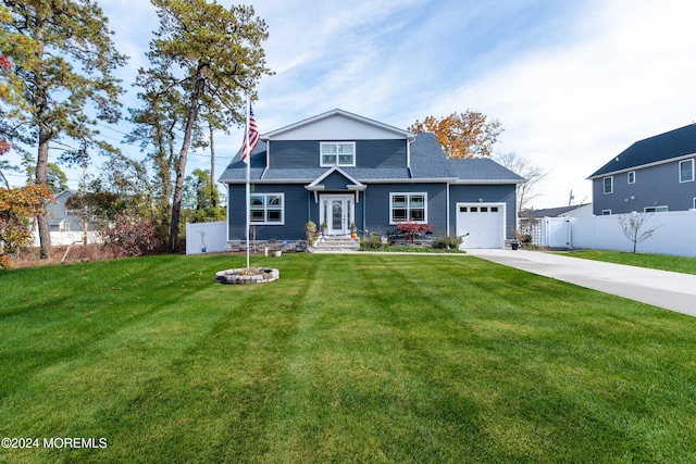 view of front of house featuring a front yard and a garage