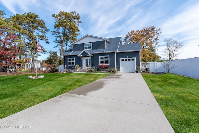 view of front of property with a front yard and a garage