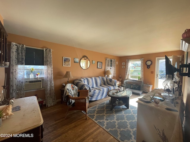 living room featuring dark hardwood / wood-style floors and cooling unit