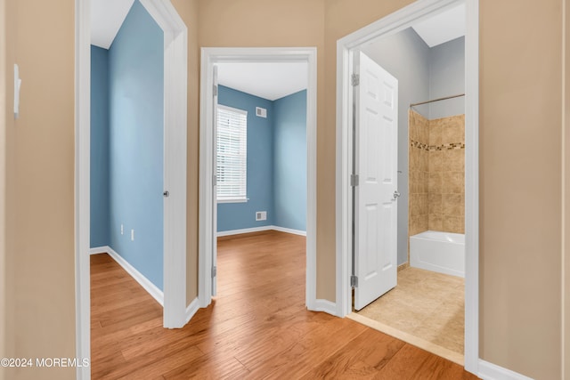 hallway featuring light hardwood / wood-style flooring