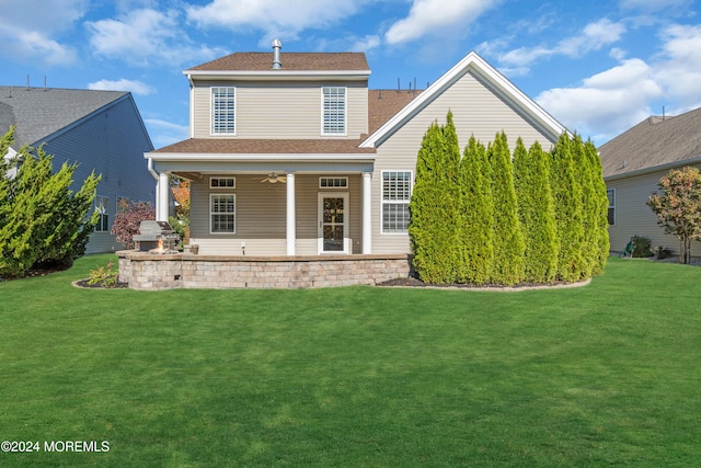 view of front of house featuring a patio area, a front lawn, and ceiling fan