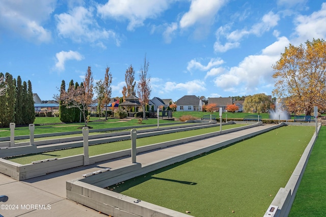 surrounding community featuring a gazebo and a lawn