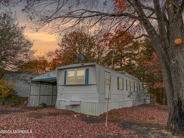 view of property exterior at dusk