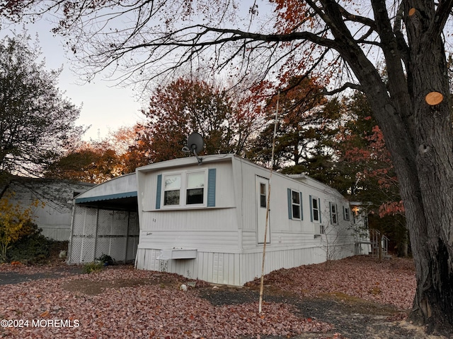 view of side of property featuring a carport