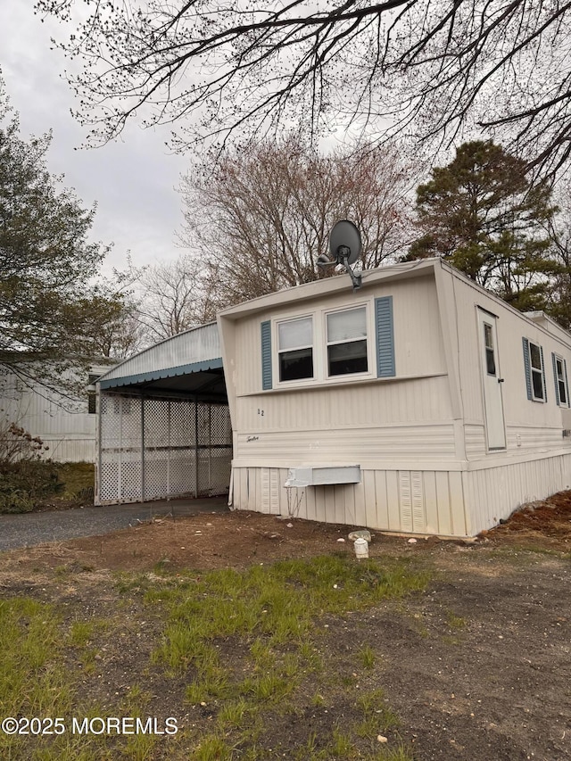 view of property exterior with driveway