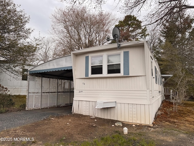 exterior space featuring driveway and a carport
