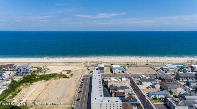 aerial view featuring a beach view and a water view