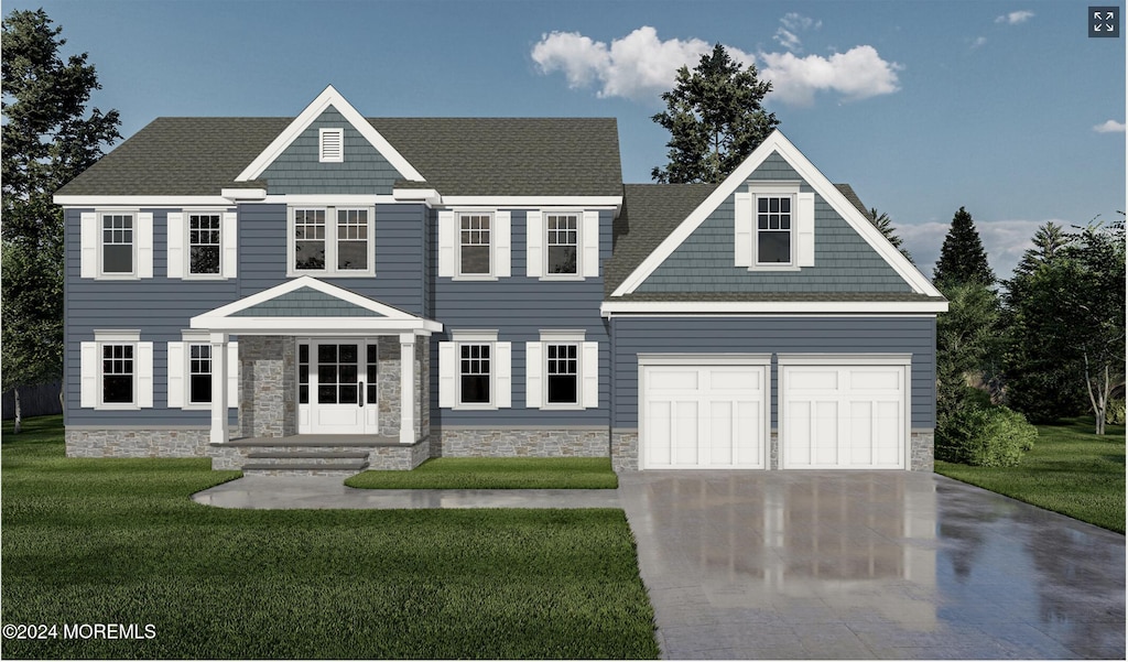 view of front of home with a garage and a front lawn