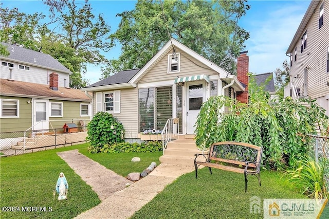 view of front of home with a front yard