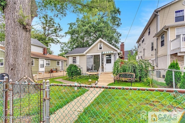 bungalow with a front yard