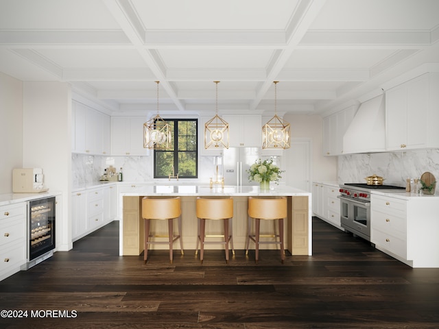 kitchen with wine cooler, a breakfast bar area, custom range hood, range with two ovens, and a center island