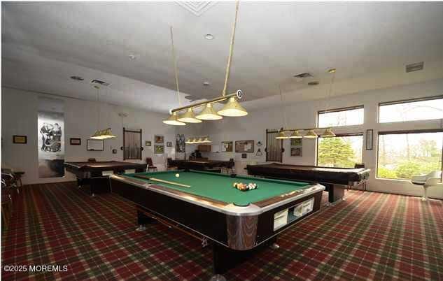 game room with pool table and dark colored carpet