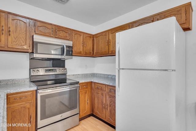 kitchen featuring appliances with stainless steel finishes and light wood-type flooring