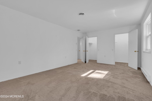 unfurnished bedroom featuring light colored carpet