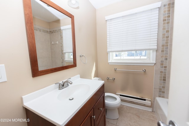 bathroom with tile patterned flooring, toilet, a bathtub, vanity, and baseboard heating