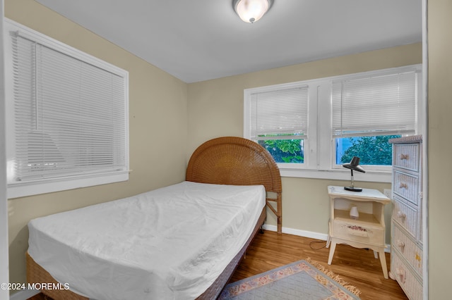 bedroom featuring wood-type flooring