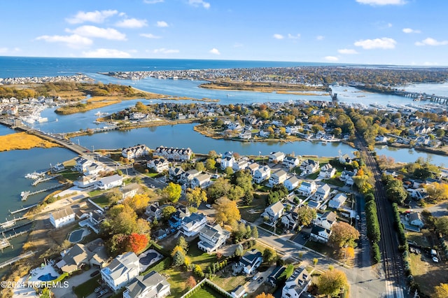 drone / aerial view with a water view