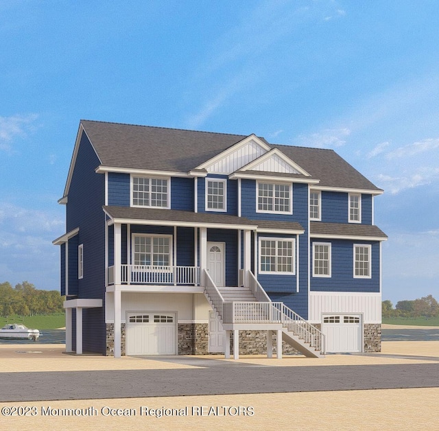 view of front facade with covered porch and a garage