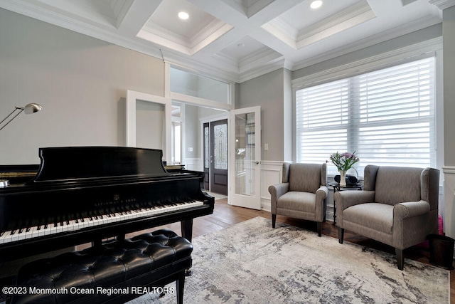 interior space with coffered ceiling, ornamental molding, and beamed ceiling