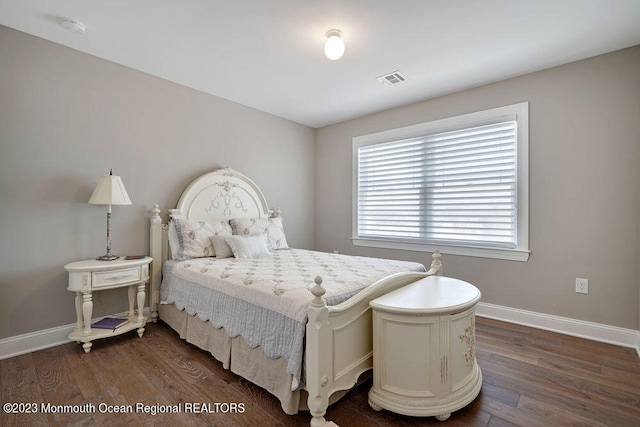 bedroom featuring dark hardwood / wood-style flooring