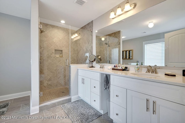 bathroom with vanity and walk in shower