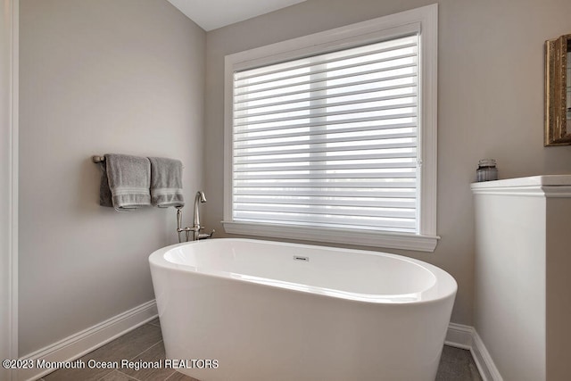 bathroom featuring a tub to relax in