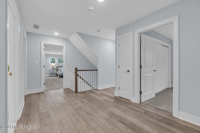 hall with light hardwood / wood-style floors