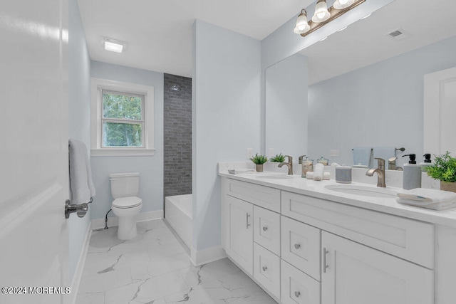 bathroom featuring toilet, a tub to relax in, and vanity