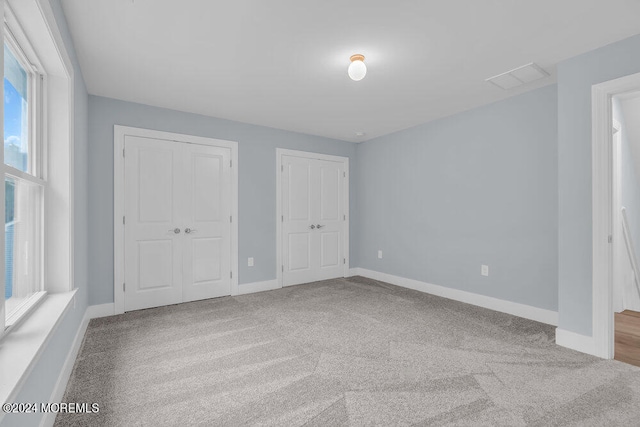 unfurnished bedroom featuring carpet floors