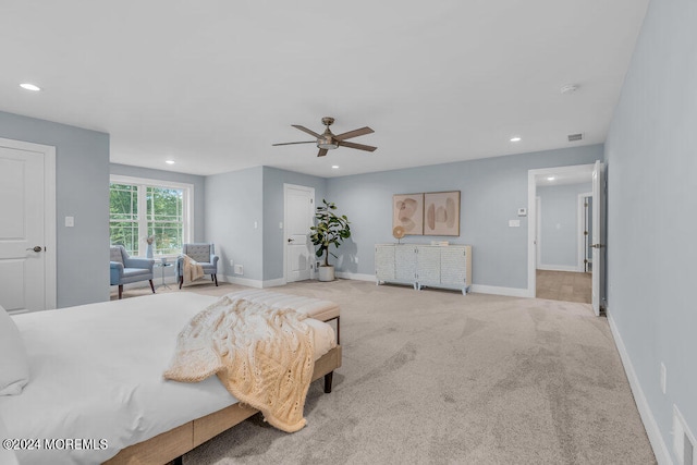 bedroom featuring light colored carpet and ceiling fan